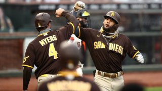 SAN FRANCISCO, CALIFORNIA – JULY 28: Fernando Tatis Jr. #23 of the San Diego Padres is congratulated by Wil Myers #4 after he hit a three-run home run in the third inning against the San Francisco Giants at Oracle Park on July 28, 2020 in San Francisco, California. (Photo by Ezra Shaw/Getty Images)