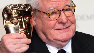 Alan Parker poses in the Press Room at the EE British Academy Film Awards at The Royal Opera House on February 10, 2013 in London, England.