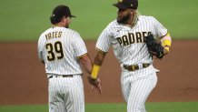 SAN DIEGO, CALIFORNIA - JULY 25: Fernando Tatis Jr. #23 of the San Diego Padres and Kirby Yates #39 of the San Diego Padres celebrate defeating the Arizona Diamondbacks 5-1 in a game at PETCO Park on July 25, 2020 in San Diego, California. (Photo by Sean M. Haffey/Getty Images)