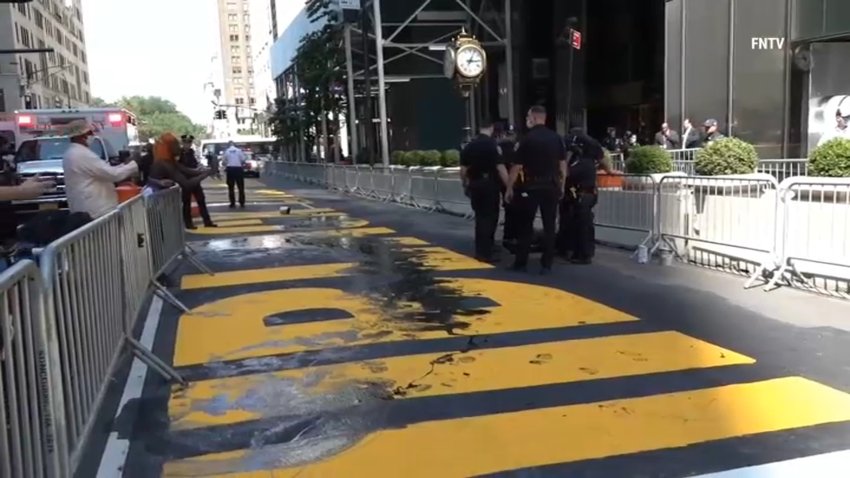 police arrest at least two suspects for dumping paint on a mural
