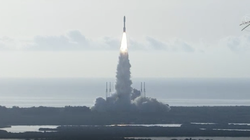 A rocket carrying a Mars rover lifts off.