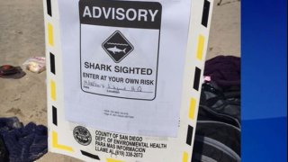 A shark sign previously posted on the Silver Strand