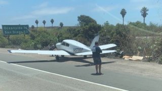 A small plane on the shoulder of I-5 near Camp Pendleton