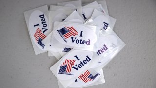 In this March 3, 2020, file photo, “I Voted” stickers are stacked at the polling place where Democratic presidential candidate Sen. Bernie Sanders (I-VT) and his wife Jane O’Meara Sanders voted in their state’s primary election at the Robert Miller Community Center in Burlington, Vermont.