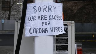 A sign at a gas station alerts customers that a business in Queens is closed on April 3, 2020, in New York City.