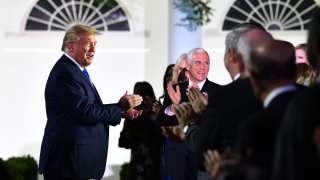 President Donald Trump, alongside Vice President Mike Pence, arrives to listen to US First Lady Melania Trump address the Republican Convention