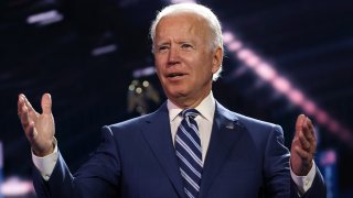 In this Aug .19, 2020, file photo, Democratic presidential nominee Joe Biden appears on stage after Democratic vice presidential nominee U.S. Sen. Kamala Harris (D-CA) spoke on the third night of the Democratic National Convention from the Chase Center in Wilmington, Delaware.