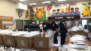National City Police officers getting bags of school supplies organized at John Otis Elementary School on Thursday morning.