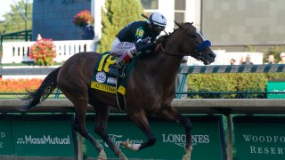 Jockey John Velazquez rides Authentic to the finish line to win the 146th running of the Kentucky Derby at Churchill Downs, Saturday, Sept. 5, 2020, in Louisville, Kentucky.