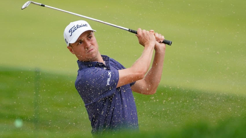 Justin Thomas, of the United States, plays a shot from a bunker on the 17th hole during the first round of the US Open Golf Championship