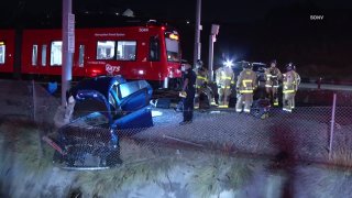 First responders respond to the scene of a deadly car crash involving a trolley in Encancto on Monday, Sept. 28, 2020.