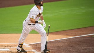 SAN DIEGO, CA – SEPTEMBER 09: Mitch Moreland #18 of the San Diego Padres hits a home run in the bottom of the first inning against the Colorado Rockies at PETCO Park on September 9, 2020 in San Diego, California. (Photo by Matt Thomas/San Diego Padres/Getty Images)