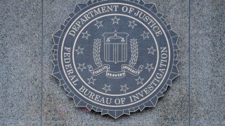 Close-up of the seal of the Federal Bureau of Investigation (FBI) of the wall of J Edgar Hoover FBI Building, Washington DC, January 21, 2017.