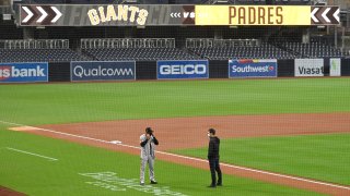 SAN DIEGO, CA β SEPTEMBER 11: Manager Gabe Kapler (L)of the San Francisco Giants speaks with general manager Scott Harris before a scheduled baseball game against the San Diego Padres at Petco Park on September 11, 2020 in San Diego, California. The game has been postponed after a member of the San Francisco Giants was tested positive for the coronavirus (COVID-19). (Photo by Denis Poroy/Getty Images)