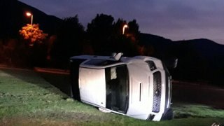 Toyota Tacoma on its side in Hilltop Park