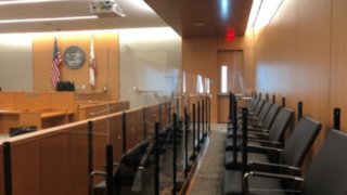 Picture of courtroom with plexiglass