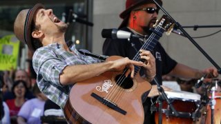 Jason Mraz, left, performs with his band on the NBC "Today" television program in New York Friday, Aug. 7, 2009. (AP Photo/Richard Drew)