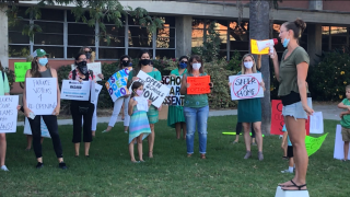 Parents and students rally outside of San Diego Unified School District Education Center