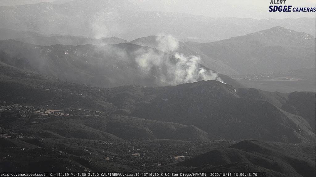 The view of a small brush fire burning near Descanso, shot form an SDG&E camera positioned atop Mount Cuyamaca, facing south.