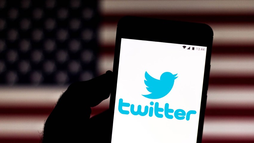 In this photo illustration a Twitter logo is seen on a smartphone.
