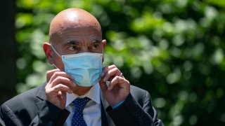 Moncef Slaoui, the former head of GlaxoSmithKlines vaccines division, listens as U.S. President Donald Trump delivers remarks about coronavirus vaccine development in the Rose Garden of the White House on May 15, 2020 in Washington, DC. Dubbed “Operation Warp Speed,” the Trump administration is announcing plans for an all-out effort to produce and distribute a coronavirus vaccine by the end of 2020.