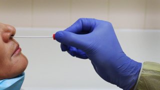 Covid-19 nasal swab test administered on patient.