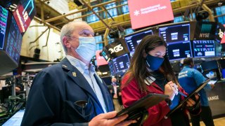 Traders work on the floor of the New York Stock Exchange.