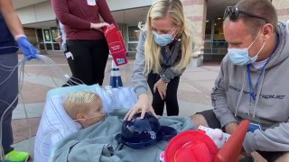 Beauden Baumkirchner, 3, met San Diego Fire-Rescue Department firefighters on Nov. 23, 2020.