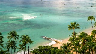 The normally packed stretch of Wakiki Beach has seen much less travelers since the onset of the Coronavirus pandemic