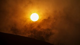 Sun sets in heavy smoke from Blue Ridge fire on October 27, 2020 in Chino Hills.