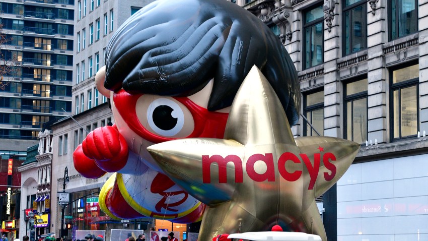 Red Titan and Macy's star balloons lined up at the 94th Annual Macy's Thanksgiving Day Parade