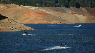 File Image: Low water levels are visible on the banks of Shasta Lake on August 30, 2014 in Redding, California. (Photo by Justin Sullivan/Getty Images)