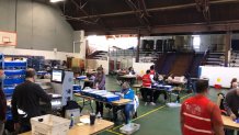 Inside the mail-in ballot counting center in Chester County, workers opened envelopes and got the ballots ready to be counted beginning on Wednesday.