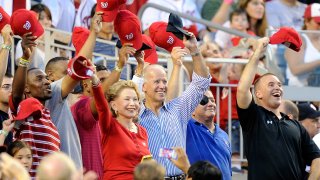 In this July 31, 2012, file photo, then Vice President of the United States Joe Biden waves to the crowd during a military salute in between innings of the game between the Philadelphia Phillies and the Washington Nationals at Nationals Park in Washington, DC.