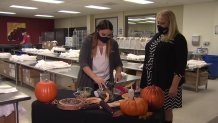 Volunteers at Mama's Kitchen hold a demonstration on making pecan pie.