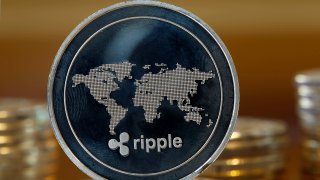 In this photo illustration, a visual representation of the digital Cryptocurrency Ripple is displayed on January 30, 2018 in Paris, France.