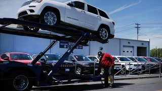 Cars sit in a dealership lot on the first day that dealerships are allowed to open to the public on May 20, 2020 in Linden, New Jersey.