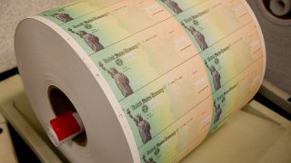 Federal stimulus checks are prepared for printing at the Philadelphia Financial Center May 8.