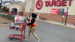 An employee outside a Target store in Clifton, N.J.