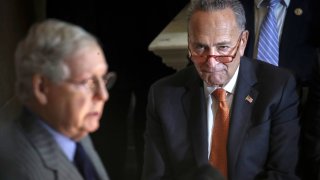 (L-R) U.S. Senate Minority Leader Chuck Schumer (D-NY) looks on as Majority Leader Mitch McConnell (R-KY) speaks during a Congressional Gold Medal ceremony at the U.S. Capitol on January 15, 2020 in Washington, DC.