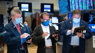 Traders work on the floor of the New York Stock Exchange.