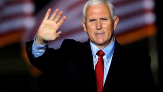 U.S. Vice President Mike Pence waves to supporters at the end of a rally in Kinston, North Carolina, October 25, 2020.