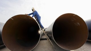 Pipeline lined up in desert, Doha.