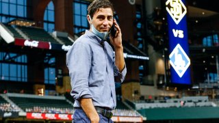 ARLINGTON, TX – OCTOBER 06: A.J. Preller, president of baseball operations for the San Diego Padres talks on his phone prior to Game 1 of the NLDS between the Los Angeles Dodgers and the San Diego Padres at Globe Life Field on Tuesday, October 6, 2020 in Arlington, Texas. (Photo by Kelly Gavin/MLB Photos via Getty Images)