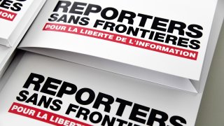 Press releases are pictured on April 25, 2018 in Paris during a press conference of Reporters Without Borders (RSF)