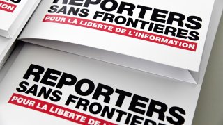 Press releases are pictured on April 25, 2018 in Paris during a press conference of Reporters Without Borders (RSF)