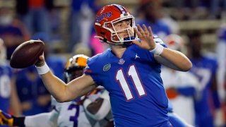 In this Dec. 12, 2020, file photo, Florida quarterback Kyle Trask (11) throws a pass against LSU during the first half of an NCAA college football game in Gainesville, Florida. Trask has been named a finalist for the Heisman Trophy. The Heisman will be awarded Jan. 5 during a virtual ceremony as the pandemic forced the cancellation of the usual trip to New York that for the presentation that usually comes with being a finalist.