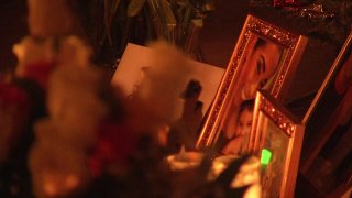 Candles and flowers lay near photographs of 42-year-old Veronica Espino, who died in an Escondido car crash on Sunday, Dec. 20, 2020.