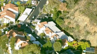 police surround a home in scripps ranch after a shooting