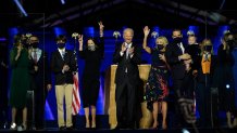 President-elect Joe Biden, center with his wife Jill Biden , right, and members of their family on stage waving to supporters, Saturday, Nov. 7, 2020, in Wilmington, Del. (AP Photo/Andrew Harnik, Pool)